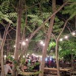 Chain of lights over beer garden in Bucharest