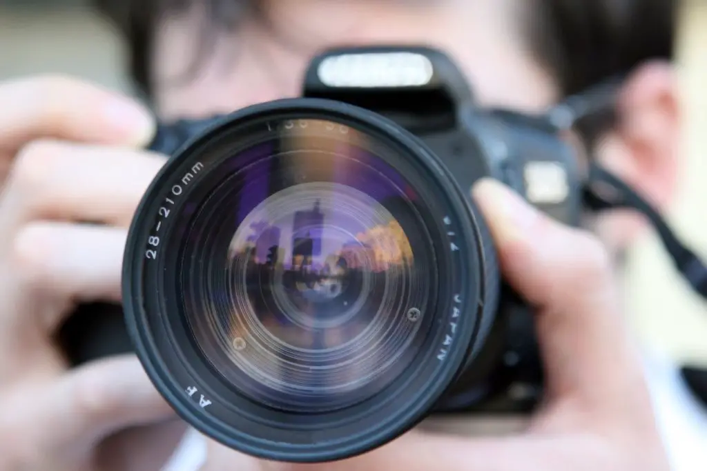 Man taking photo, camera, lens, photo task for bachelor party