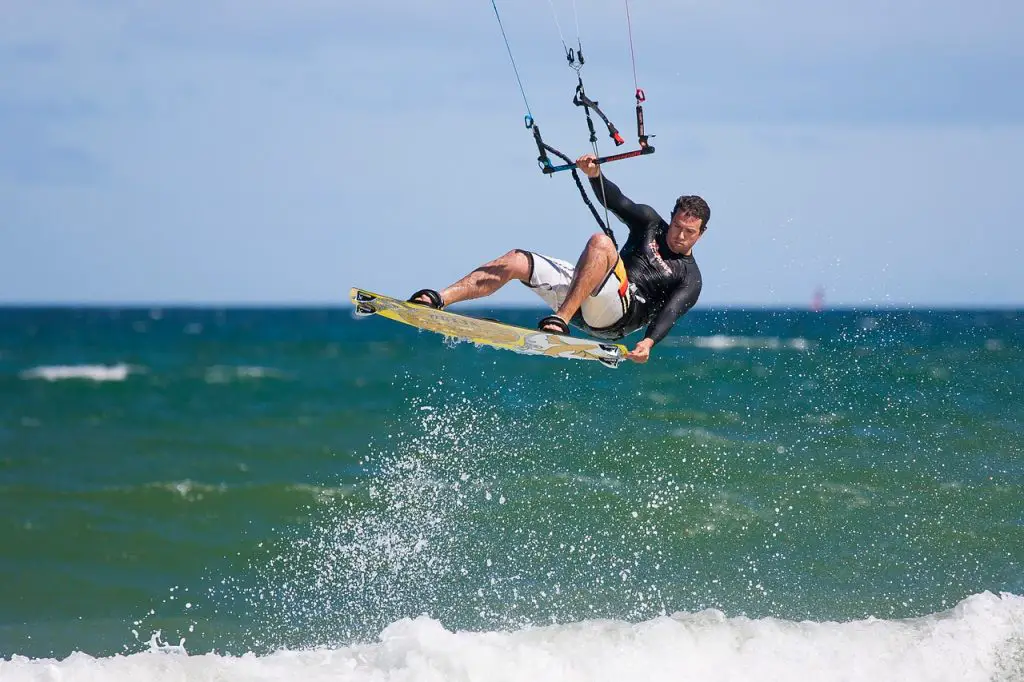 Man kitesurfing as exciting idea for bachelor party or JGA
