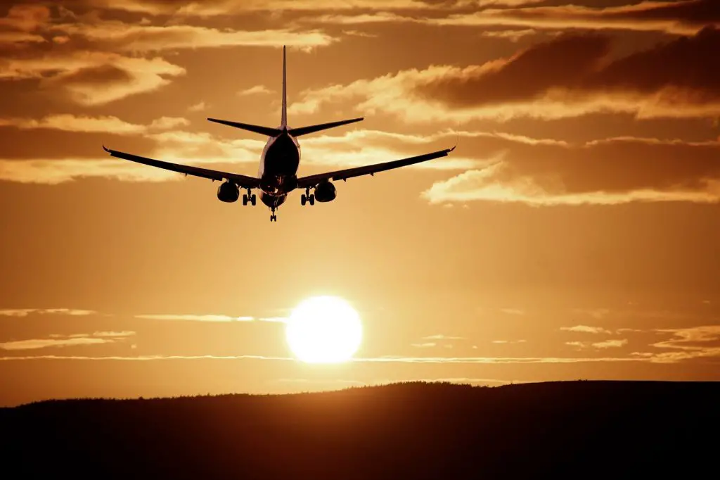 Plane flies into the sunset