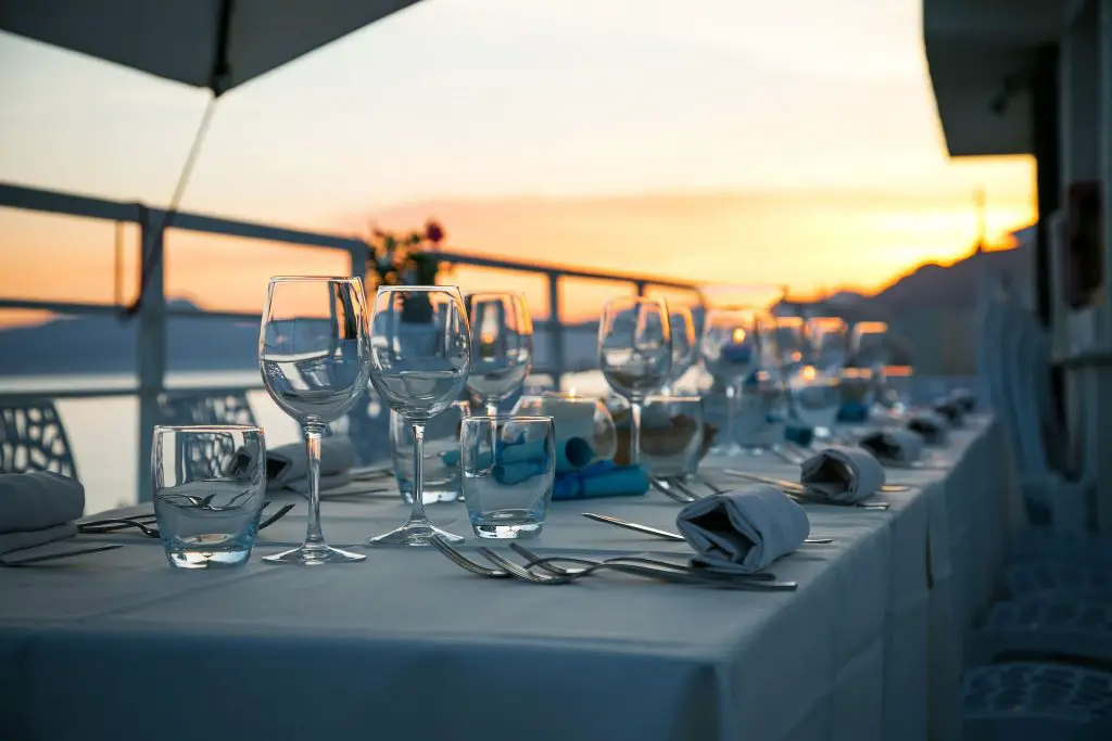 elegantly set table before sunset for rehearsal dinner